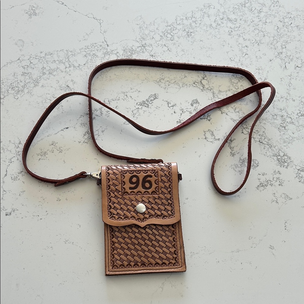Cross body hand tooled leather bag